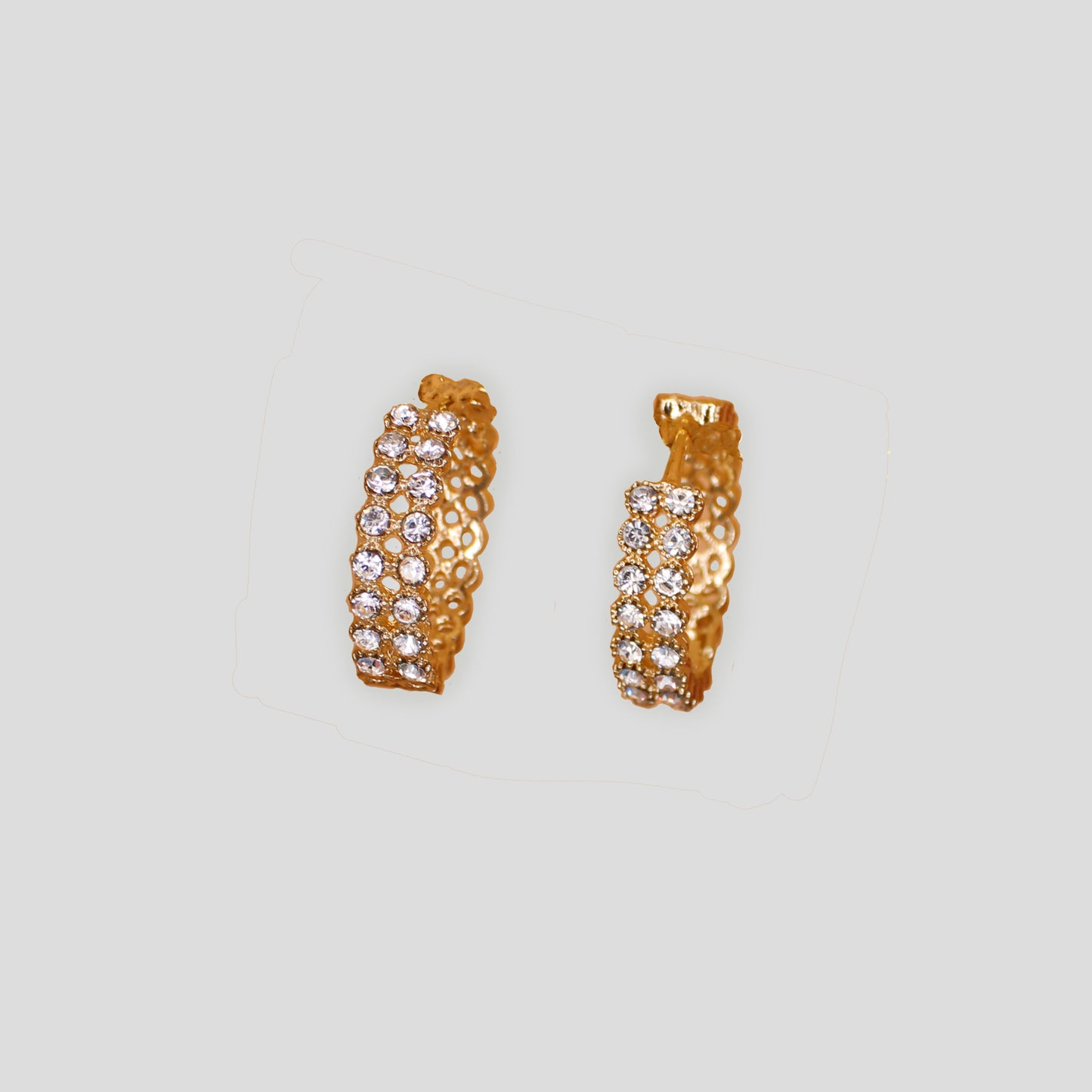 Gold-colored hoop earrings with double rows of sparkling simulant diamonds.