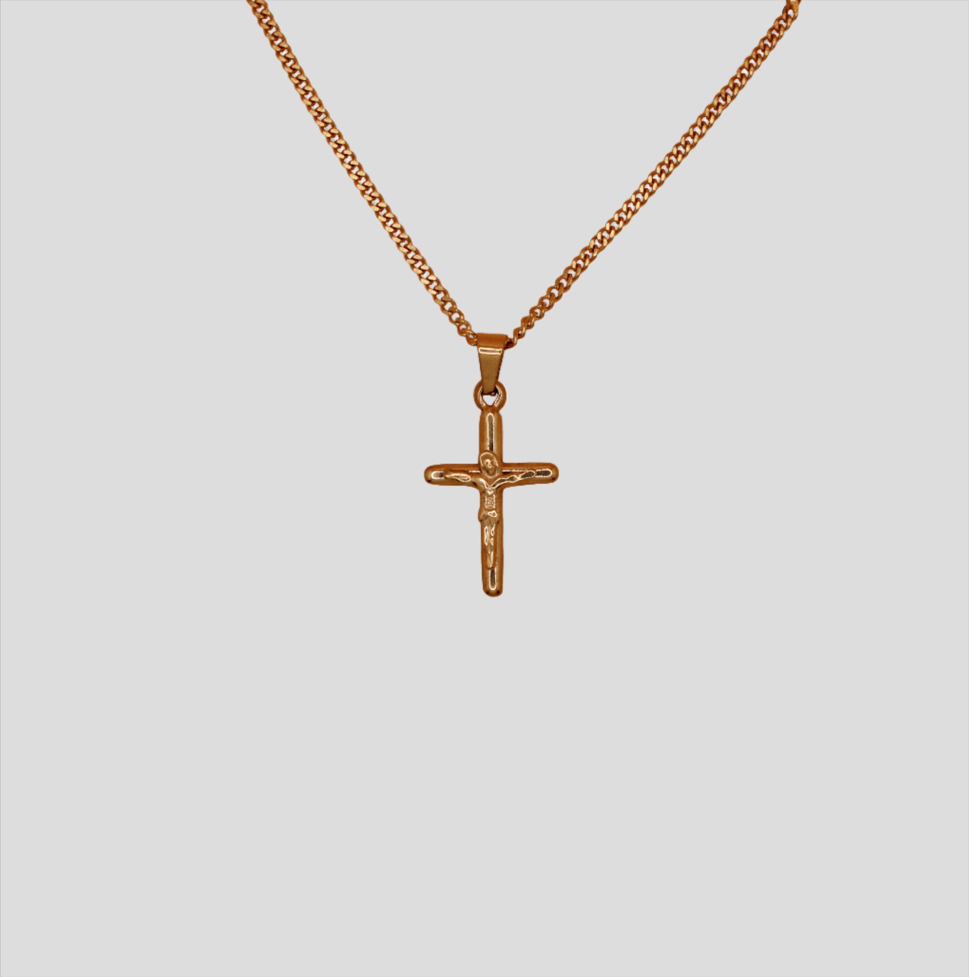 Simple chain necklace with a cross pendant.