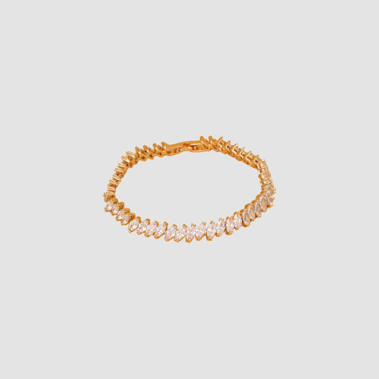 Gold-colored bracelet featuring a row of marquise-cut simulant diamonds.