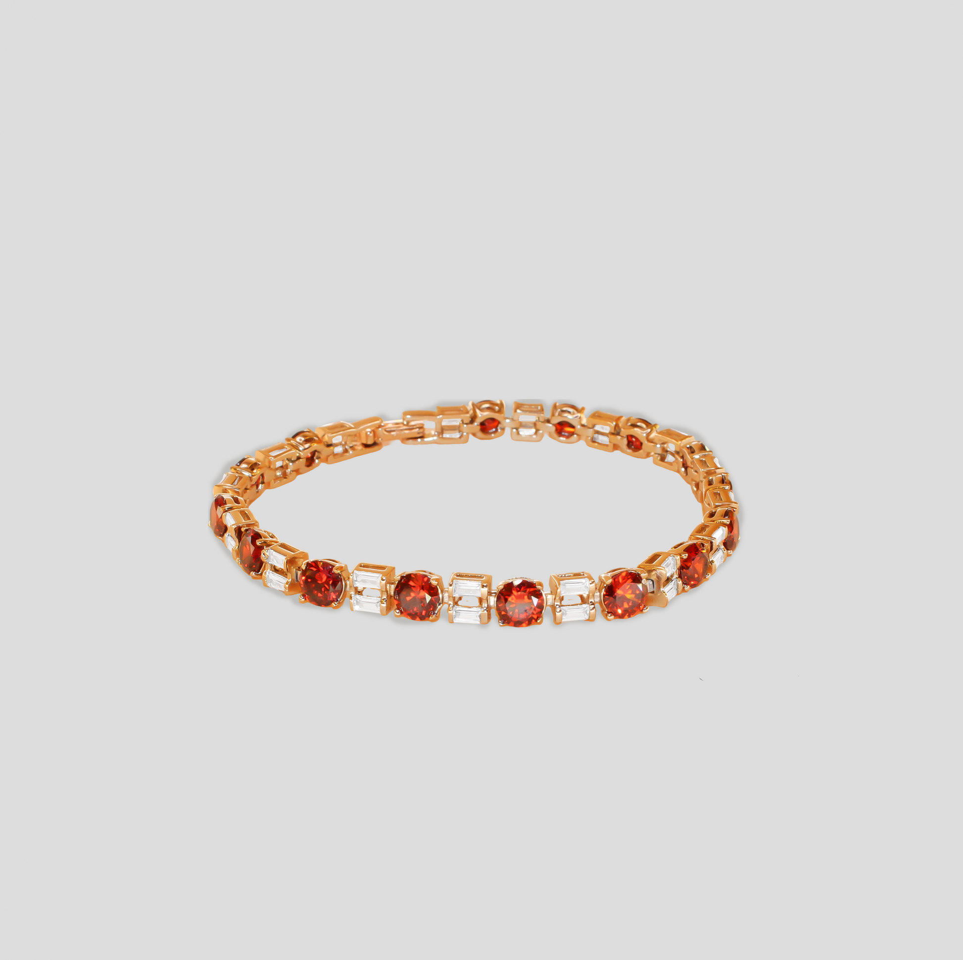 Gold-colored bracelet featuring alternating round orange-red gemstones and rectangular white simulant diamonds.