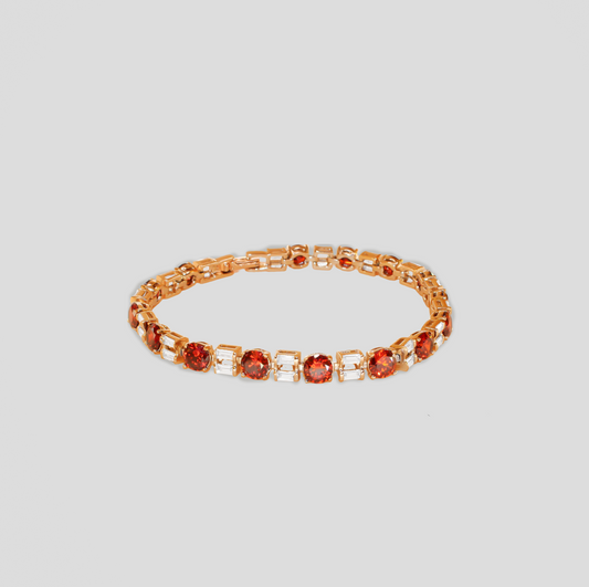 Gold-colored bracelet featuring alternating round orange-red gemstones and rectangular white simulant diamonds.