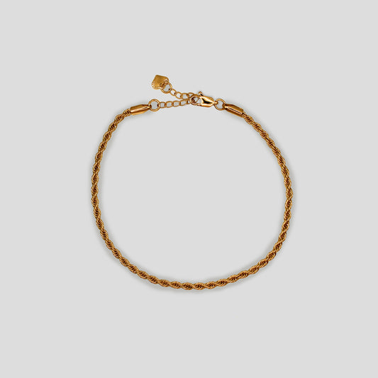 Gold-colored twisted rope chain anklet with an adjustable clasp and heart charm.