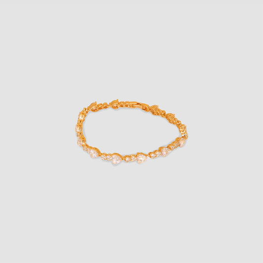 A gold color bracelet that features multiple white hearts lab-grown diamonds all around the bracelet. 