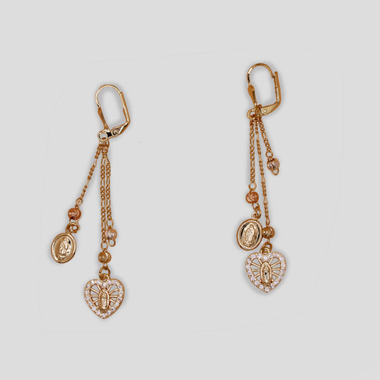 Gold color dangle earrings with religious Virgin Mary medallions and a crystal-framed heart, featuring asymmetric chains and lever-backs.