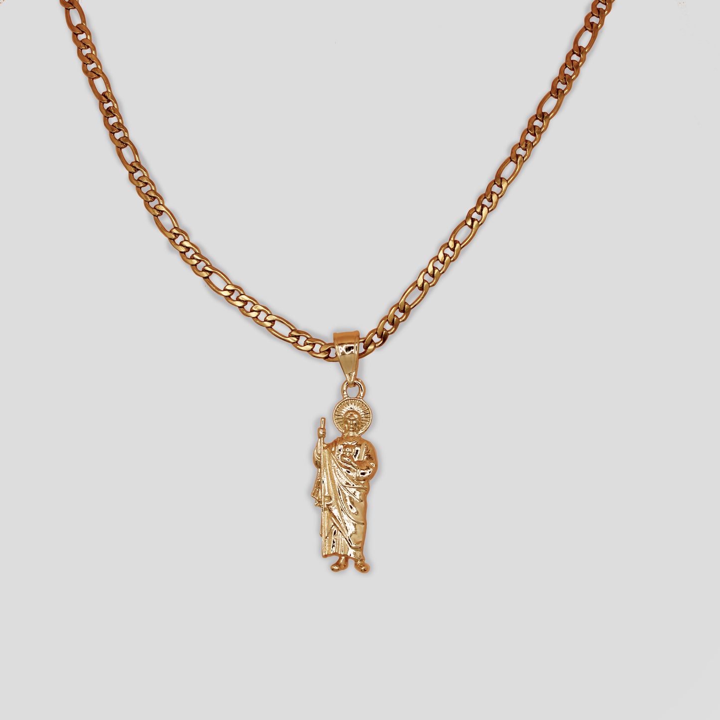 A figaro chain necklace with a San Judas pendant.