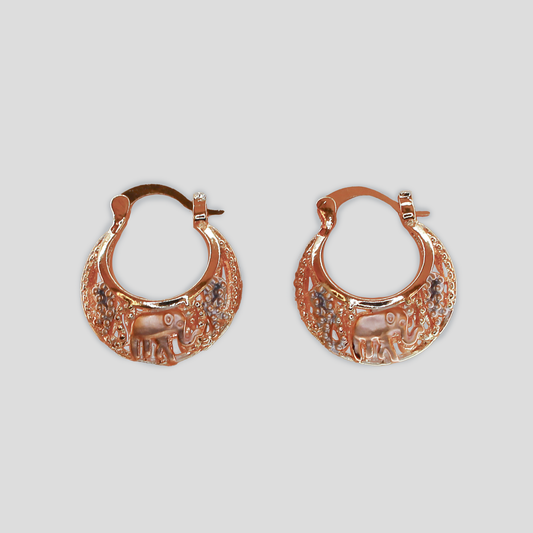 Gold-colored hoop earrings featuring an engraved elephant design with intricate detailing.